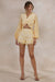 ECM_HR_CL138203121---Ksenia-_-Lemon-and-White-Broderie-Plunge-Neck-Playsuit-With-Twist-Detail1.jpg