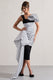 Unattainable | Vestido Midi Cruzado con Volantes y Lunares Negros