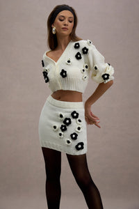 Triomphe | Falda corta de punto en color crema y detalles florales